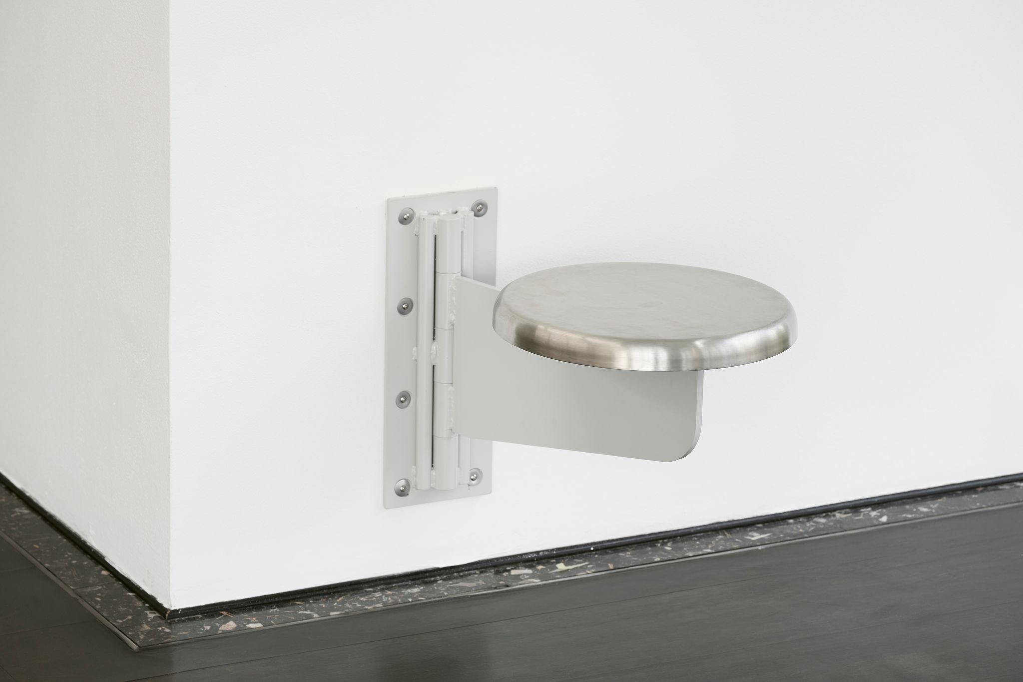 Sung Tieu, Untitled (In Cold Print), 2020, Wall mounted stainless steel stool, 47.5 ⁠× ⁠51 ⁠× ⁠36 ⁠⁠cm