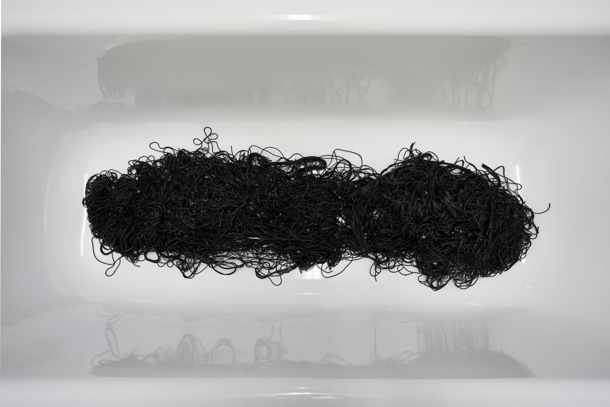 Davide Stucchi, Not too much (detail), 2017, Bathtub, squid ink spaghetti, 38 ⁠× ⁠160 ⁠× ⁠70 ⁠⁠cm