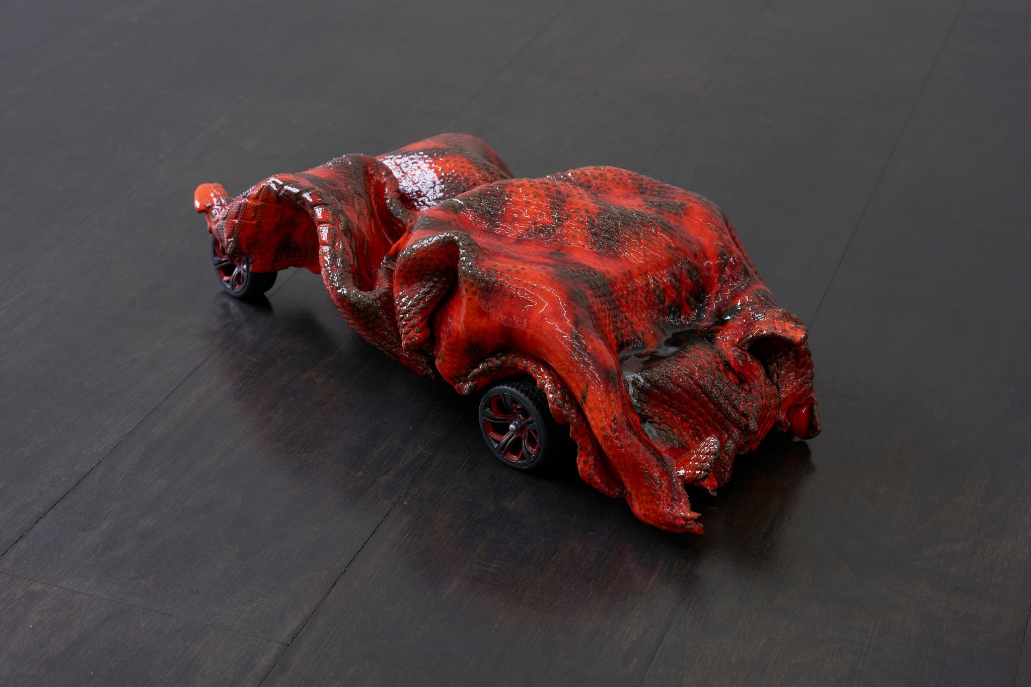 Hanna-Maria Hammari, Red Car, 2019, Glazed ceramic, rubber, plastic, steel, 15 ⁠× ⁠55 ⁠× ⁠29 ⁠⁠cm