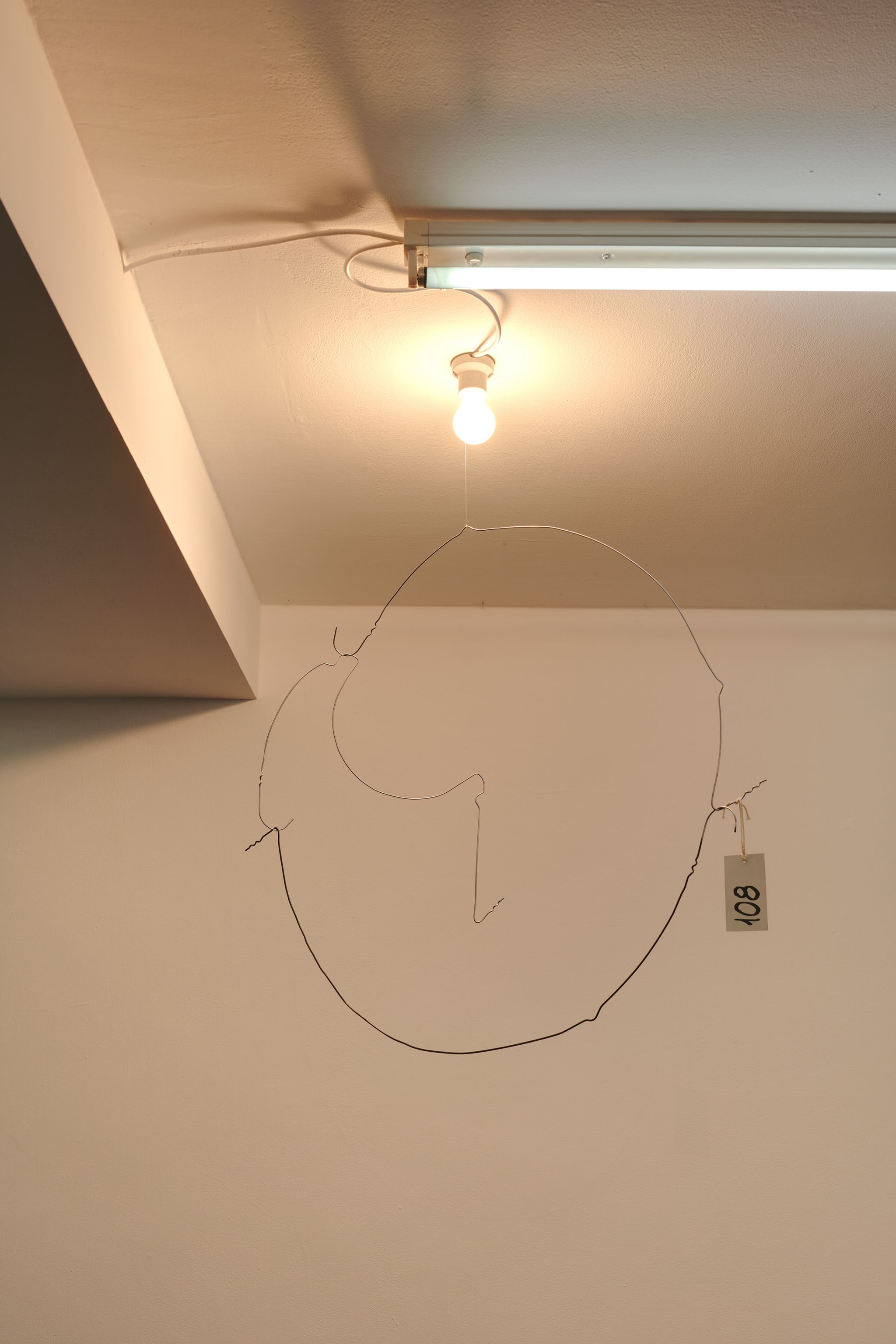 Davide Stucchi, Milan (Mobile 3) Kitchen, 2020, Ceramic lamp holder, light bulb, aluminum clothes hangers, tag, 100 ⁠× ⁠80 ⁠× ⁠25 ⁠⁠cm