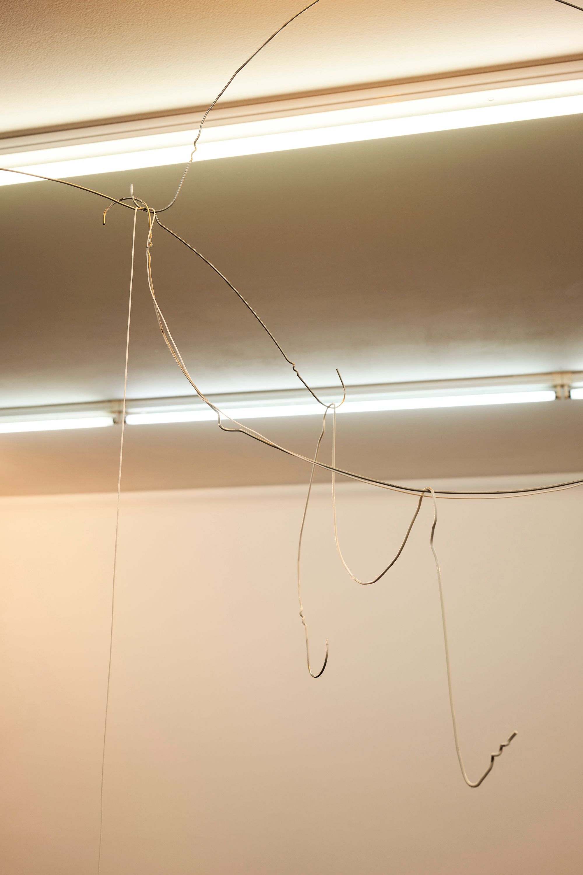 Davide Stucchi, Milan (Mobile 2) Bathroom (detail), 2020, Ceramic lamp holder, light bulb, aluminum clothes hangers, waxed cotton thread, 170 ⁠× ⁠120 ⁠× ⁠40 ⁠⁠cm