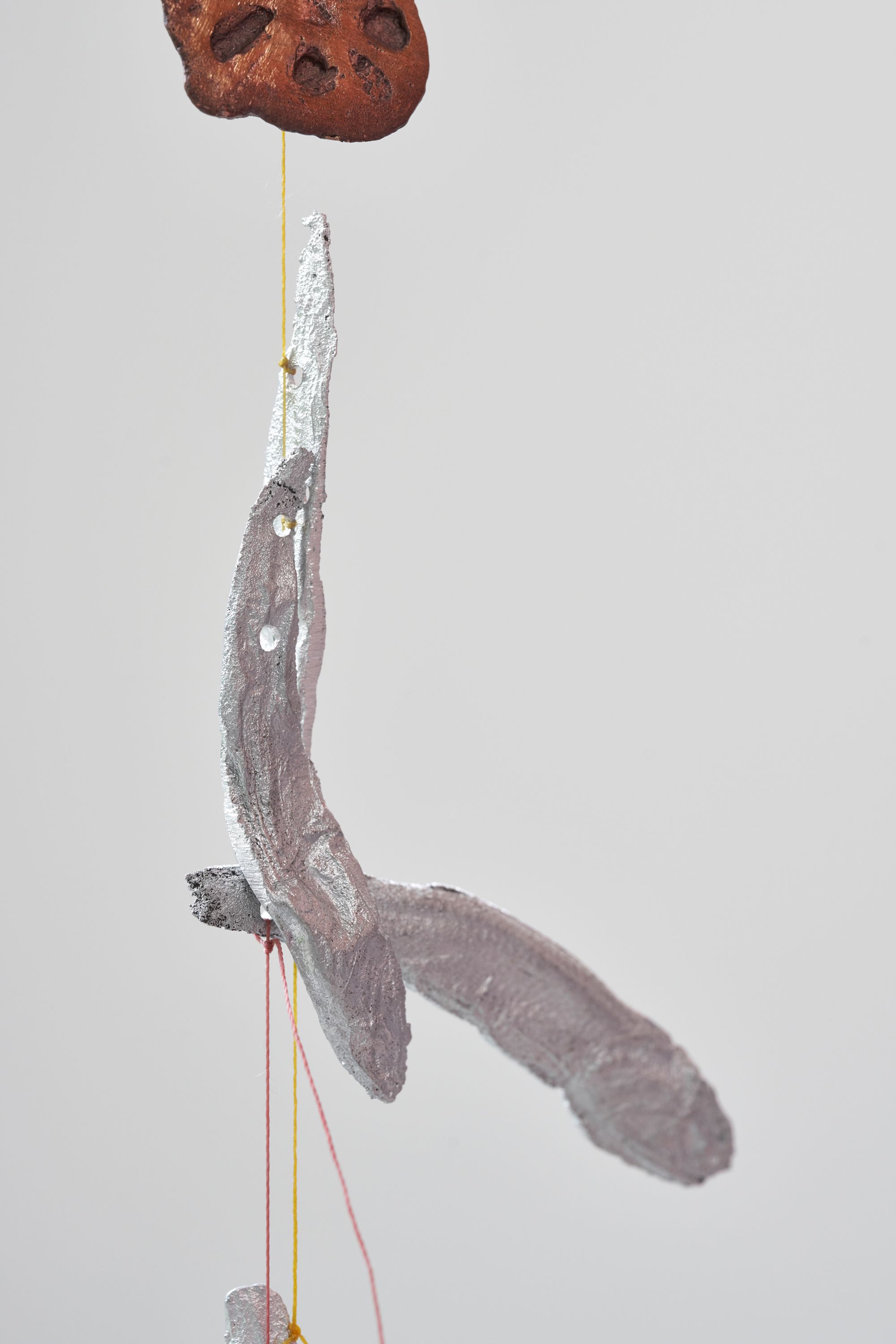 Lotus L. Kang, Tract III (detail), 2023, Cast aluminum anchovies, cast aluminum kelp knots, cast bronze lotus root, cotton thread, 300 ⁠× ⁠10 ⁠× ⁠15 ⁠cm, 118 ⁠× ⁠4 ⁠× ⁠6 inches