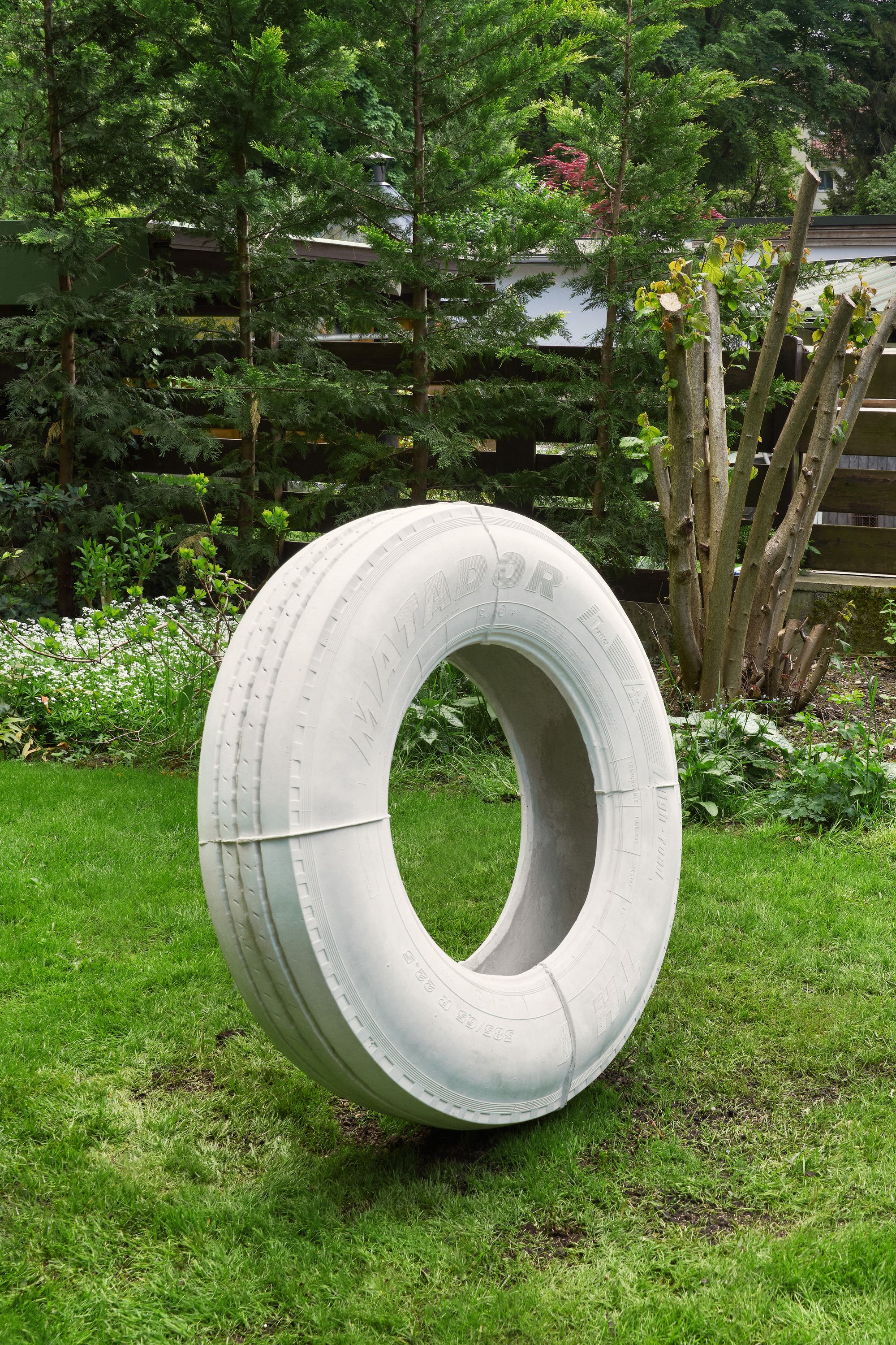 Judith Hopf, tire outdoor, 2025, Concrete, steel, 105 ⁠× ⁠105 ⁠× ⁠30 ⁠⁠cm
