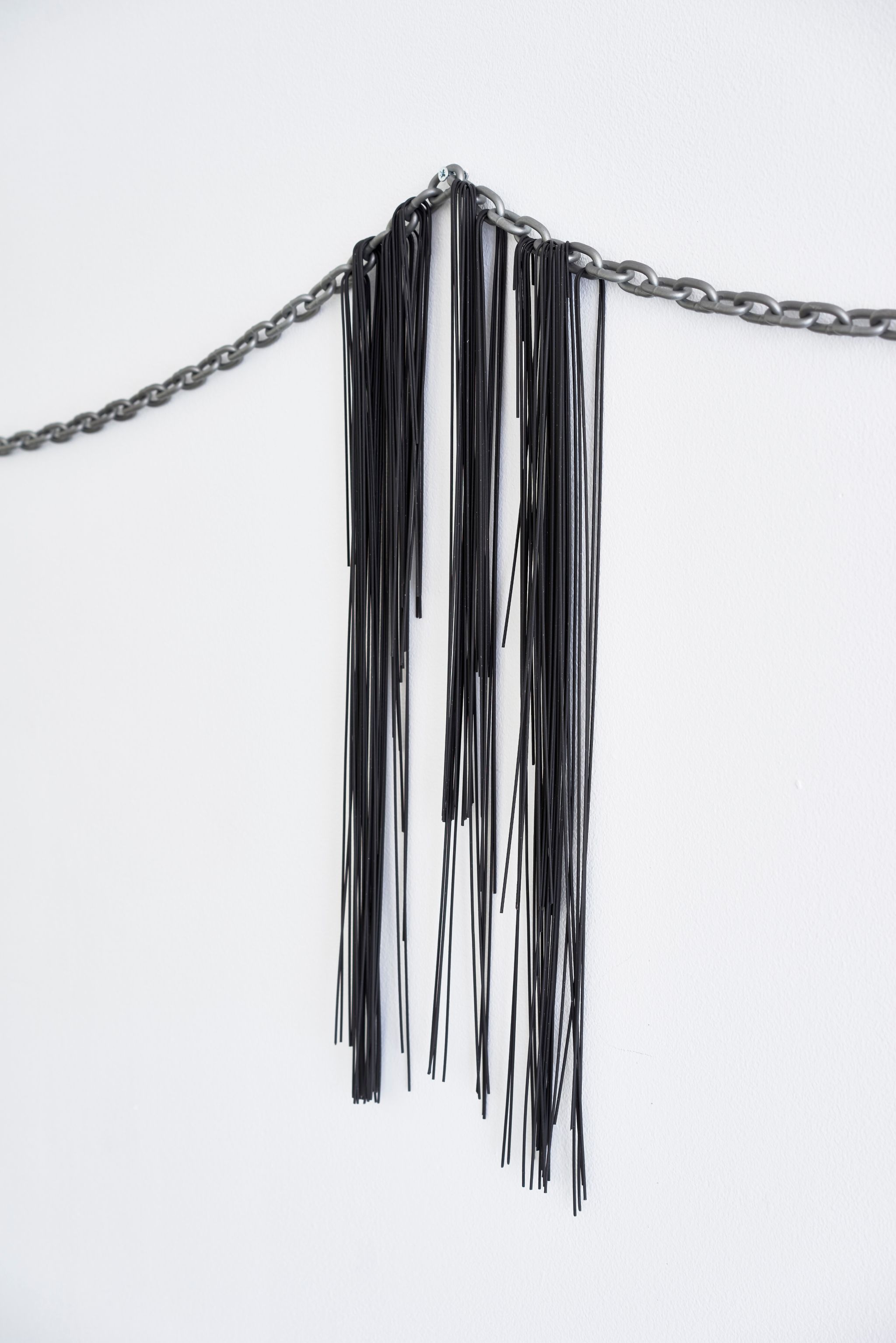 Davide Stucchi, Not much could be saved (detail), 2015, Iron chain, squid ink spaghetti, 69 ⁠× ⁠293 ⁠× ⁠2 ⁠⁠cm