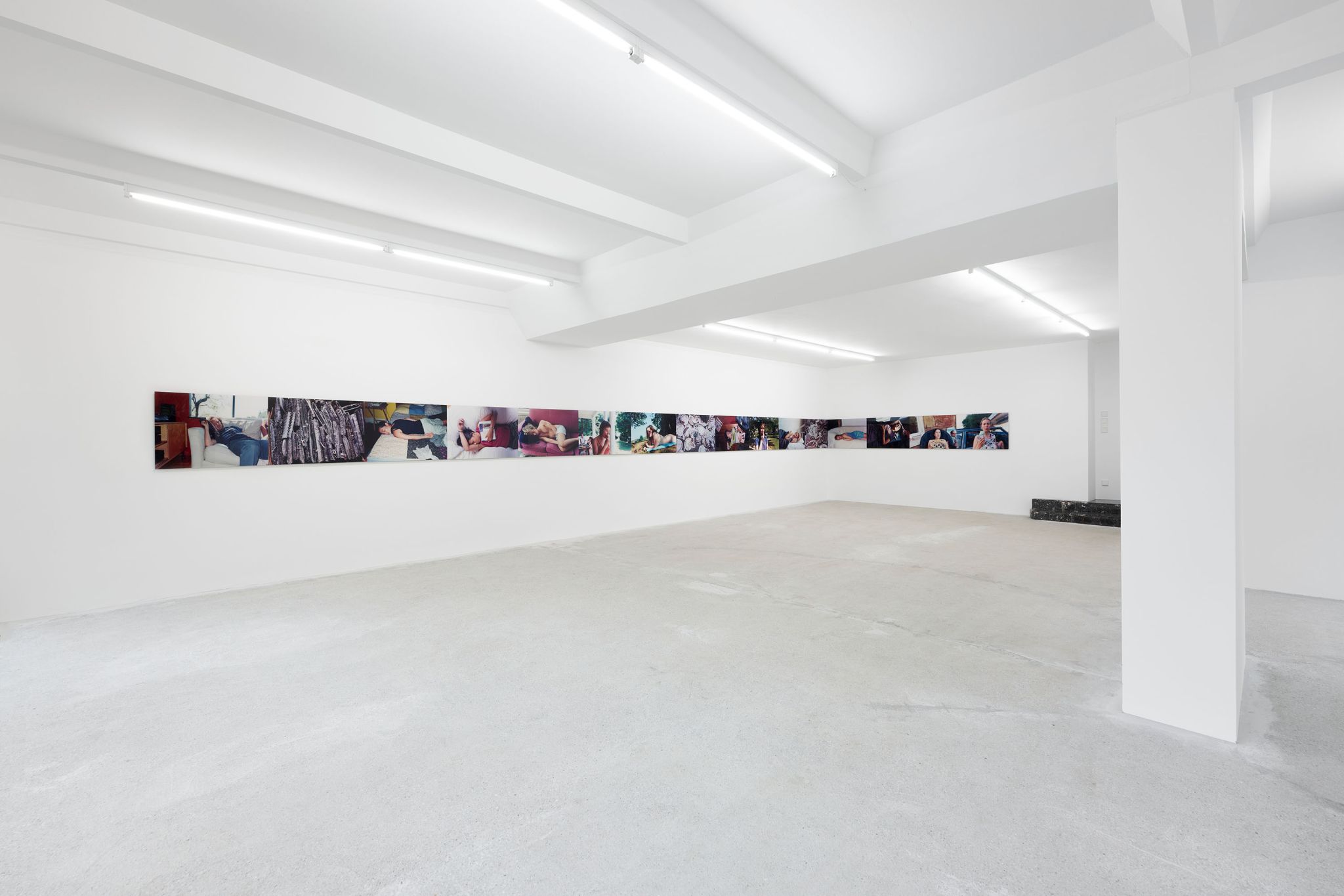 A.L. Steiner, Eat, Sleep, Disposable (retrieved), 16 photographic prints behind acrylic glass, Installation: 60 ⁠× ⁠1440 ⁠cm, Installation view, <em>Prologue: Disaster Paradise</em>