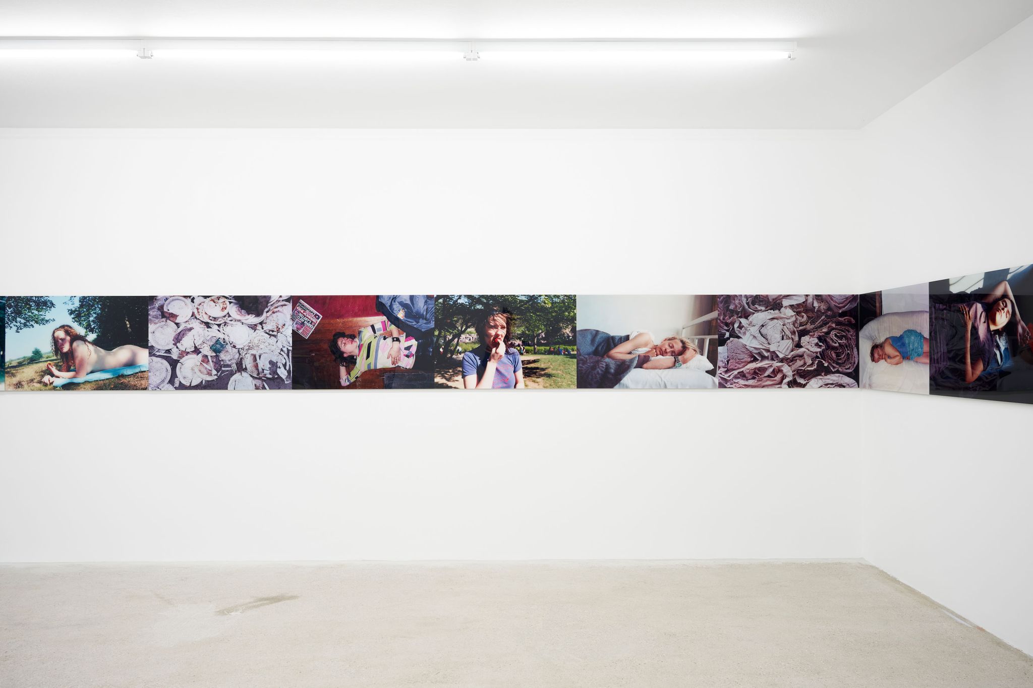 A.L. Steiner, Eat, Sleep, Disposable (retrieved) (detail), 16 photographic prints behind acrylic glass, Installation: 60 ⁠× ⁠1440 ⁠cm, Installation view, <em>Prologue: Disaster Paradise</em>