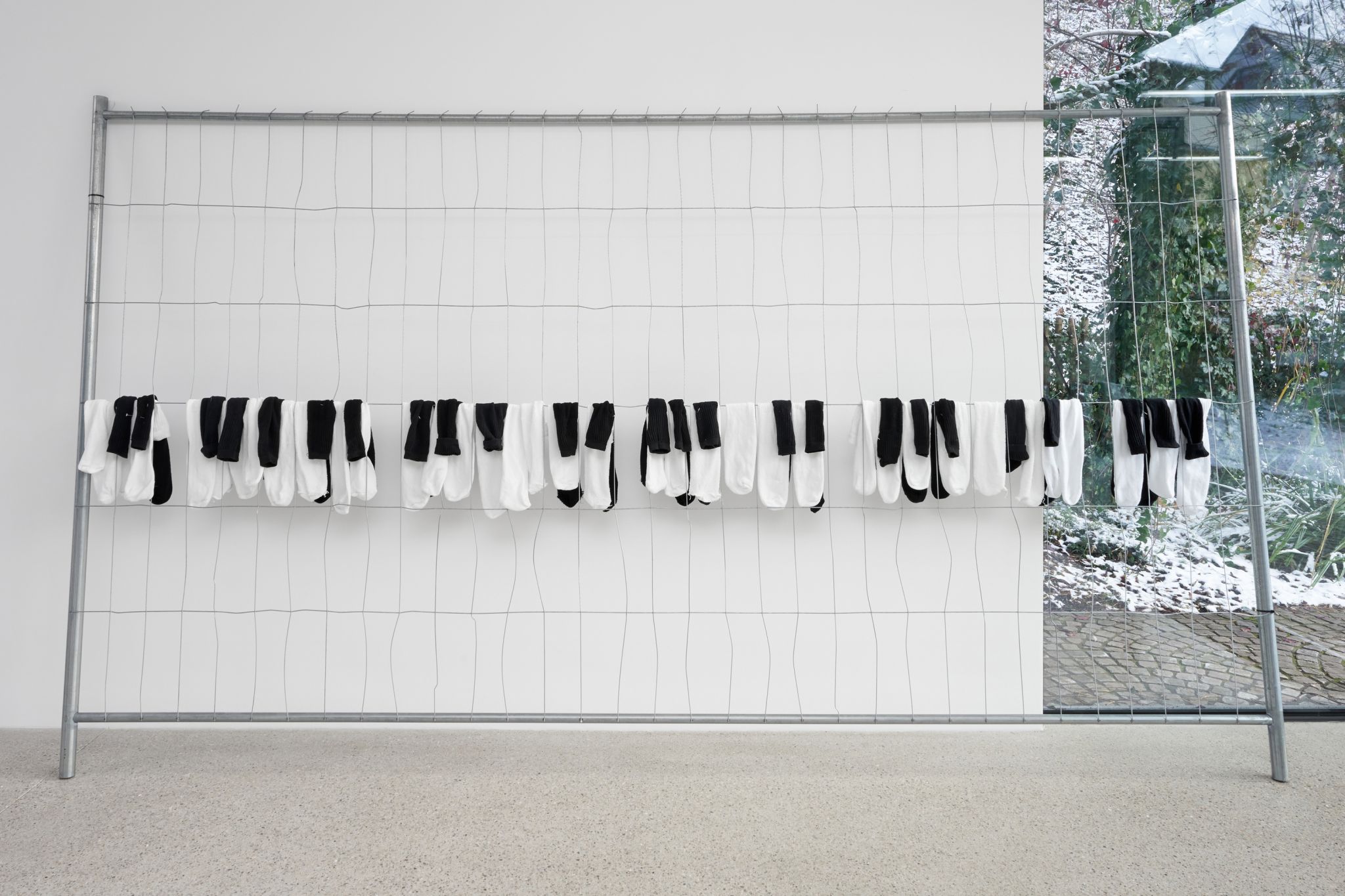 Davide Stucchi, SUITE FOR SUIT, 2023, Construction fence, cotton socks, 200 ⁠× ⁠300 ⁠× ⁠33 ⁠⁠cm